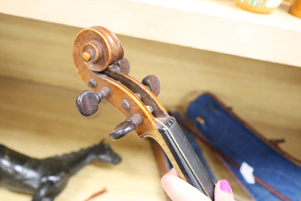 A cased violin, labelled Buthod, Paris, length of back 36cm, with bow stamped Tourte